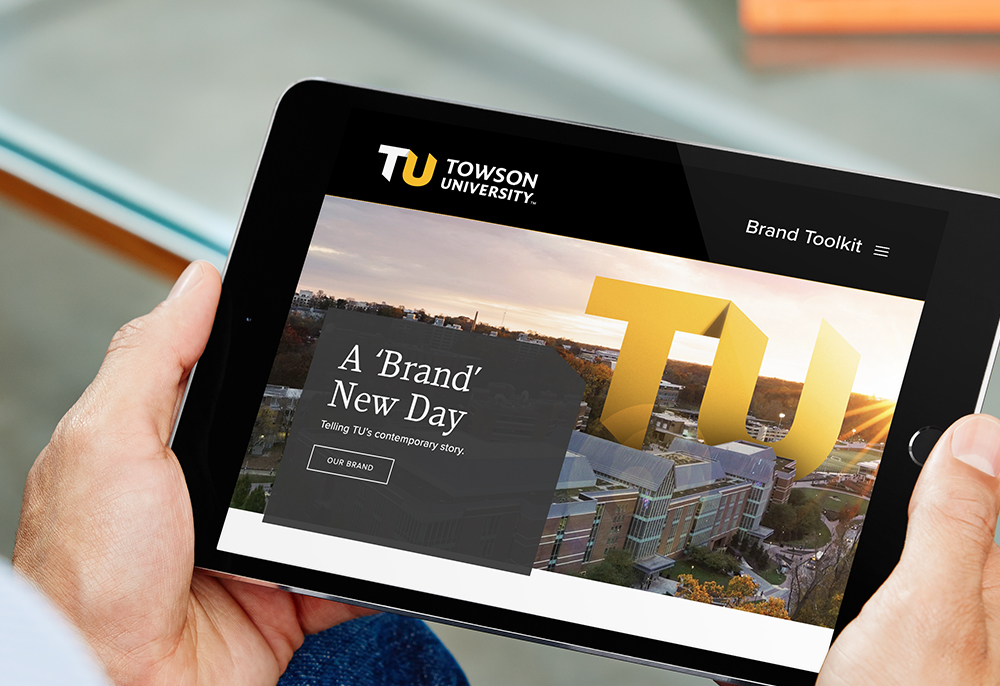 close up of someone holding a tablet that shows the TU branded toolkit