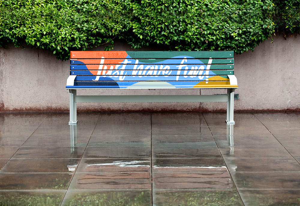 colorful park bench with the imprint just have fun