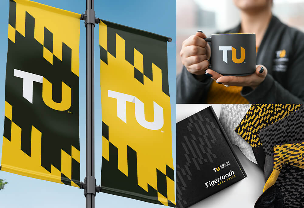 yellow and black branded TU banners, a coffee cup and other TU branded promotional items