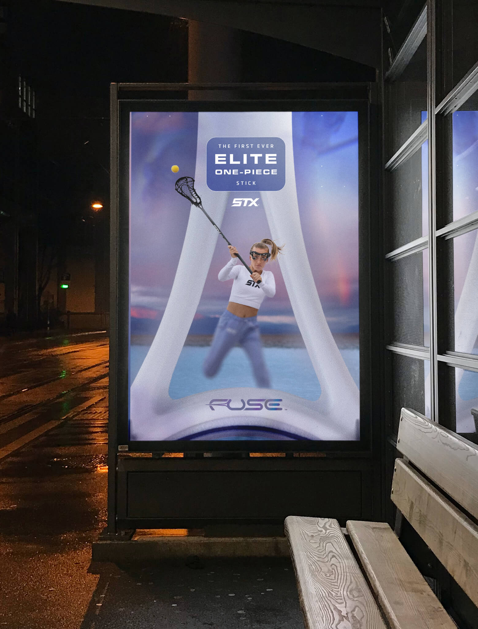 A mocked-up bus shelter ad featuring a female lacrosse player shooting the ball with the STX Fuse stick.