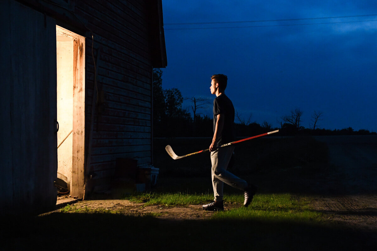 Early morning scene of a man carrying HPR2 into a brightly lit practice space.