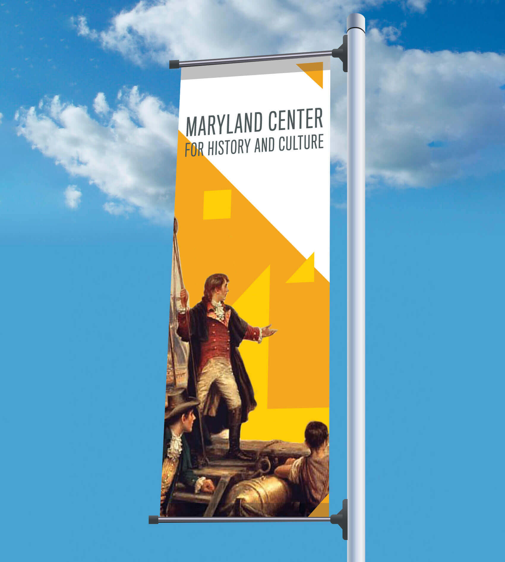 A street pole banner featuring the MCHC name and an image from their collection.