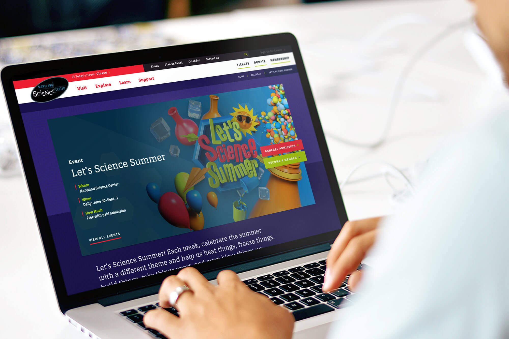 The Maryland Science Center website displayed on a laptop screen.