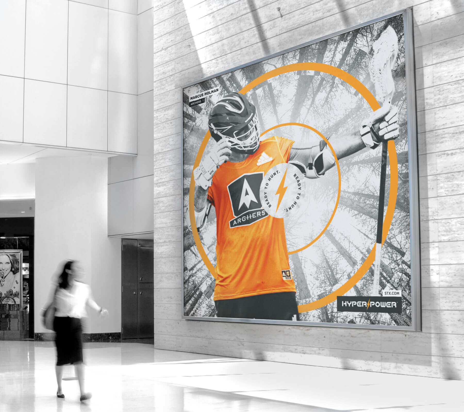 A stylized poster featuring key campaign messages and images of a male lacrosse players posing with the STX HyperPower stick.