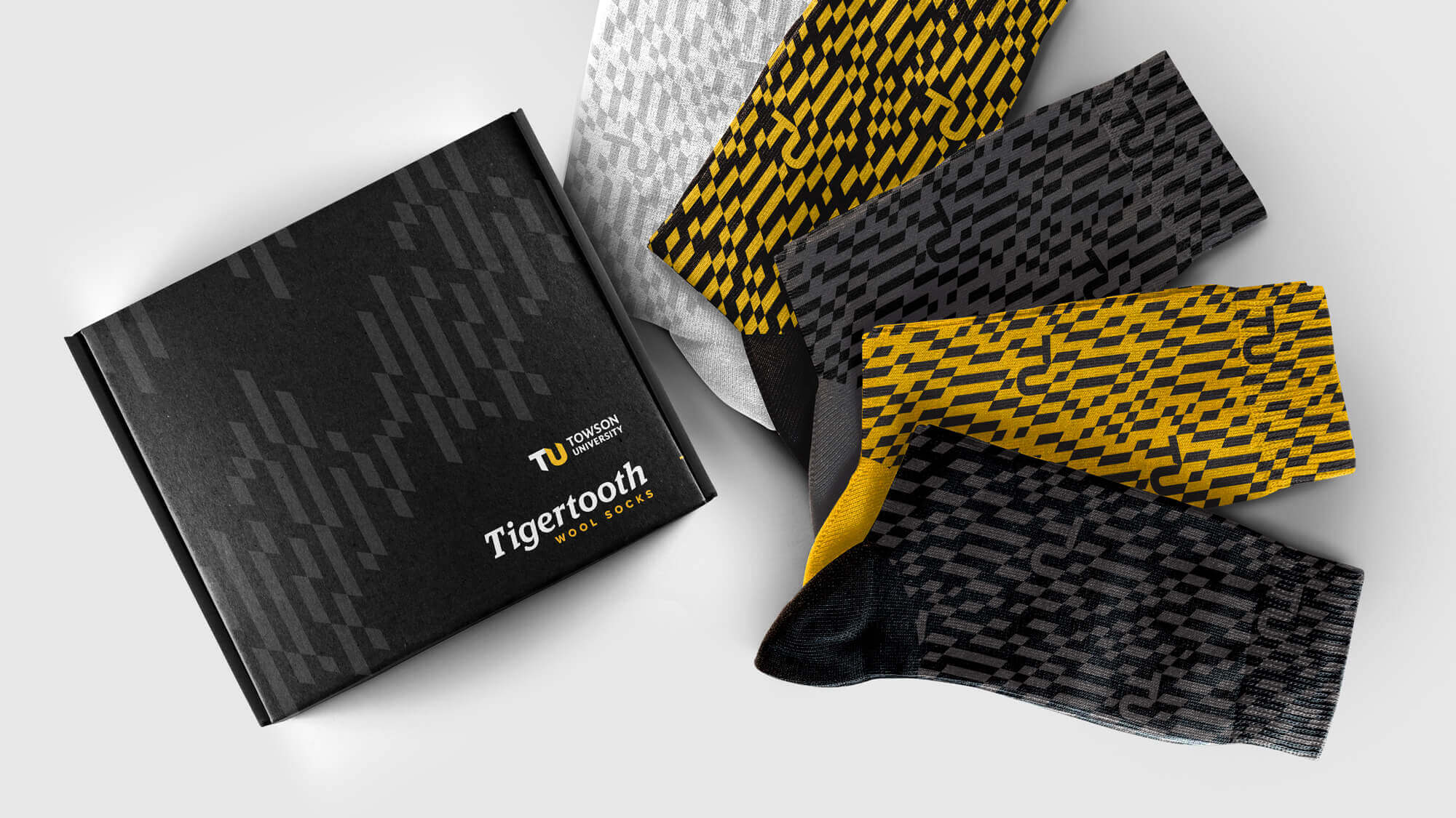 Socks featuring the TU-branded tigertooth pattern.