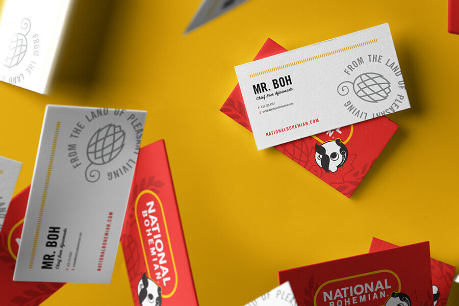 A business card with the brand logo and icon on one side and an employee’s contact info on the other side.