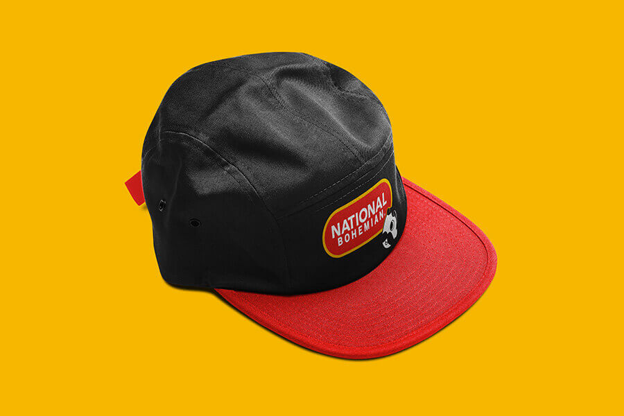 A black hat with the National Bohemian name icon and logo embroidered on the front.