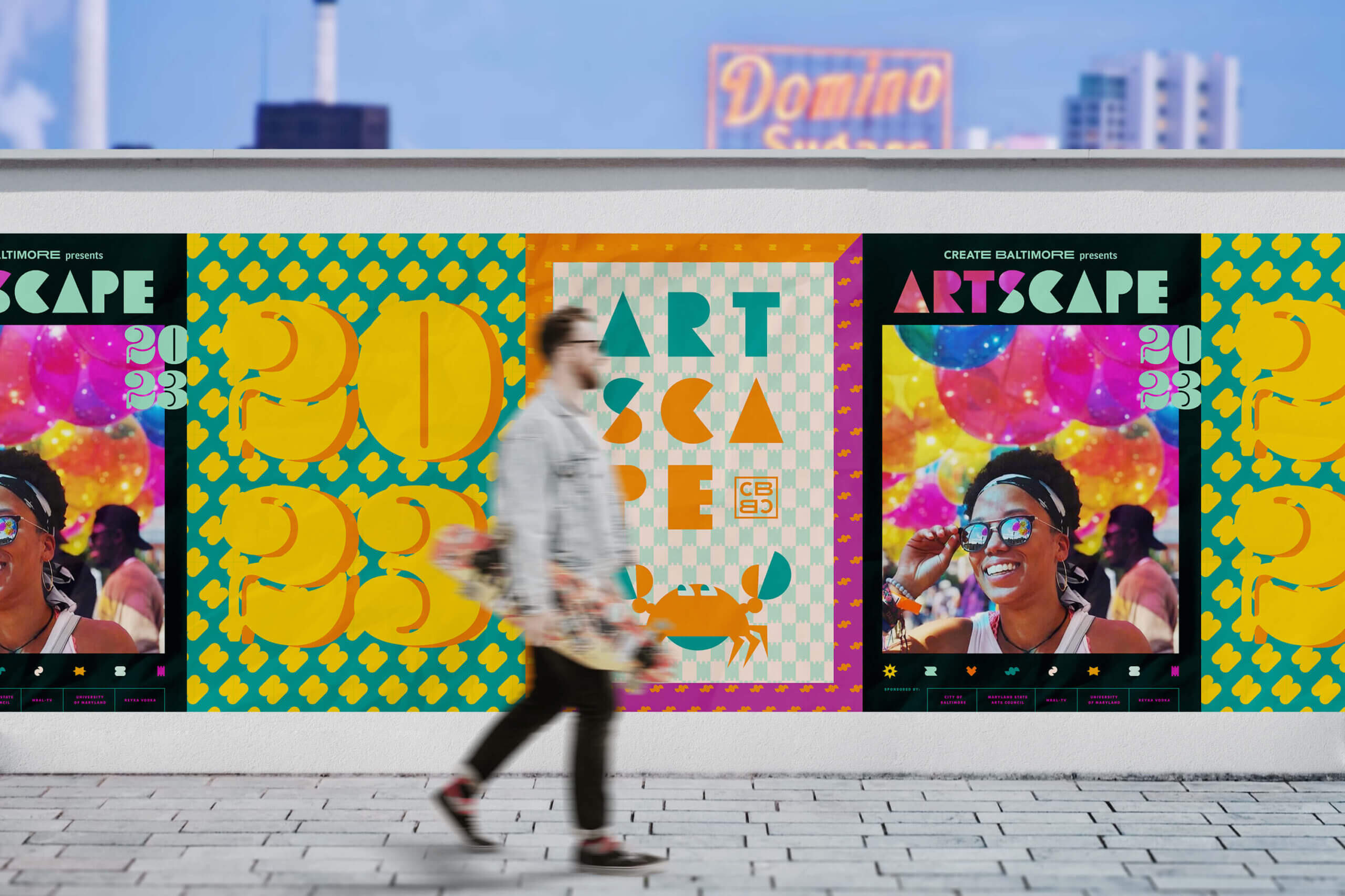 A series of outdoor posters pair the text Artscape 2023 with a collection of lively graphics and photos.