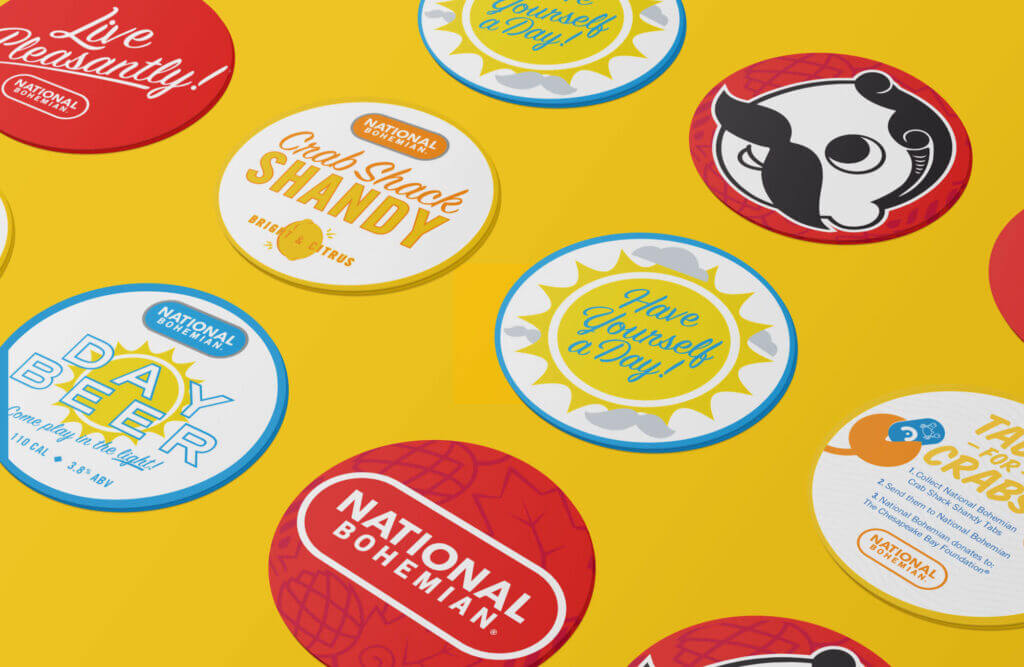 A variety of coasters featuring designs tailored to different National Bohemian beer varieties.
