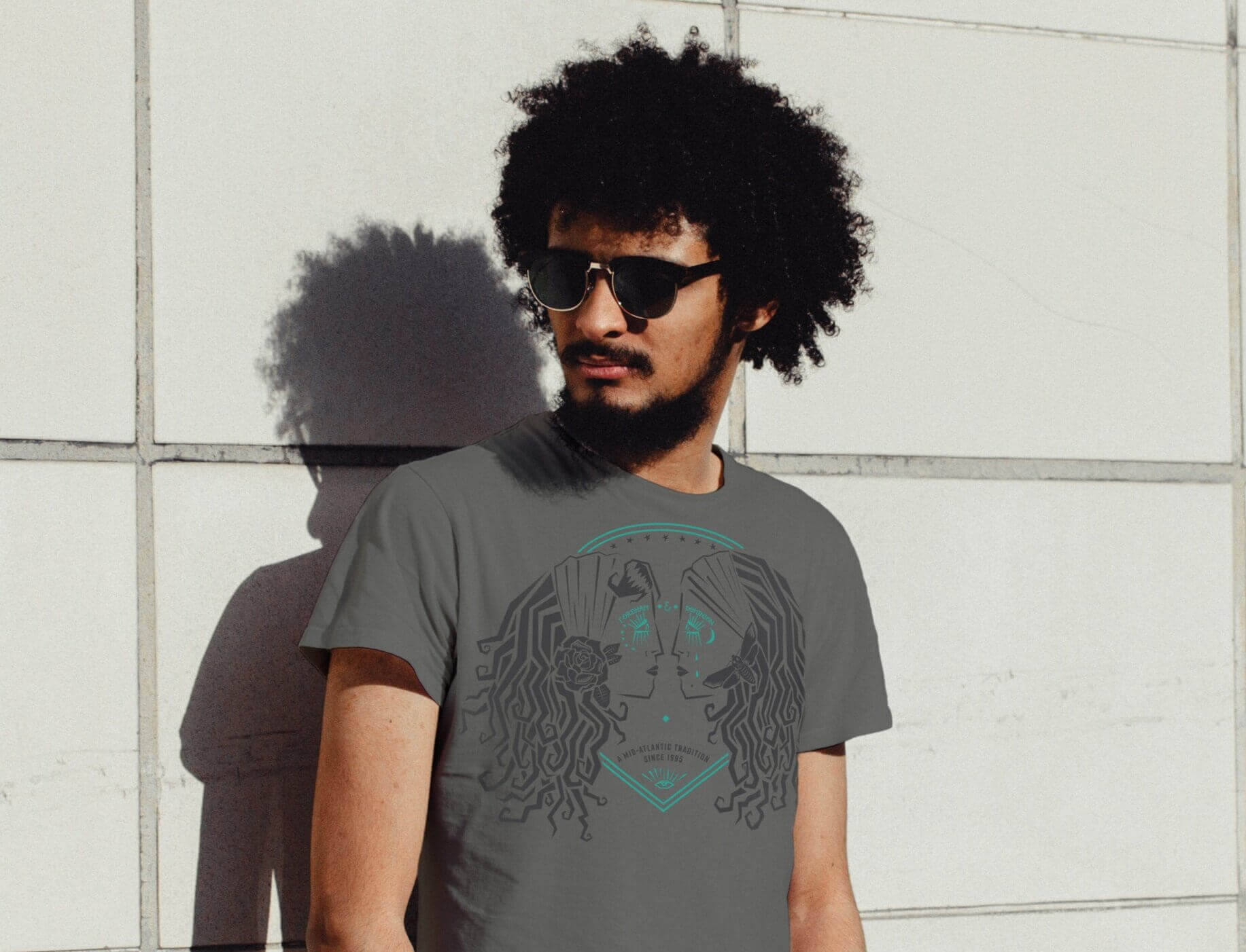 Man wearing a Fordham & Dominion T-shirt.