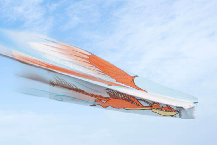 A mocked-up photo of a papercraft, flyable dragon toy.
