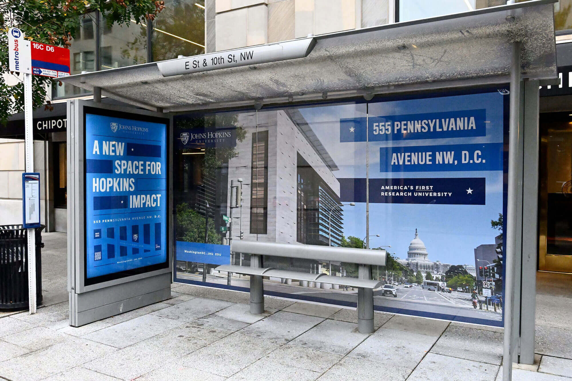 A bus shelter ad featuring imagery of the new building and key campaign messages.