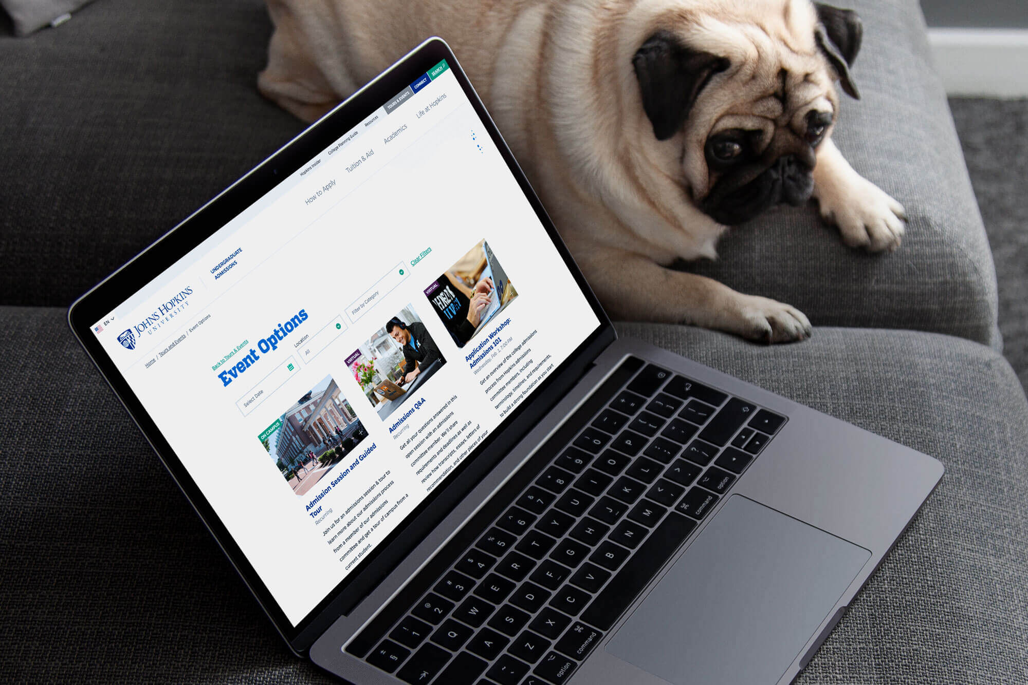 The event page displayed on a laptop screen.