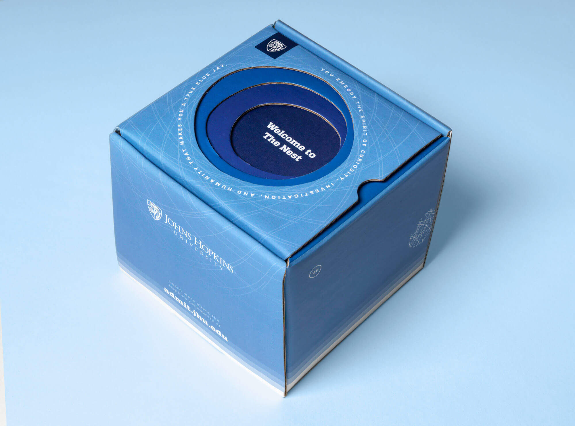 Spirit blue box printed “Welcome to the Nest.”