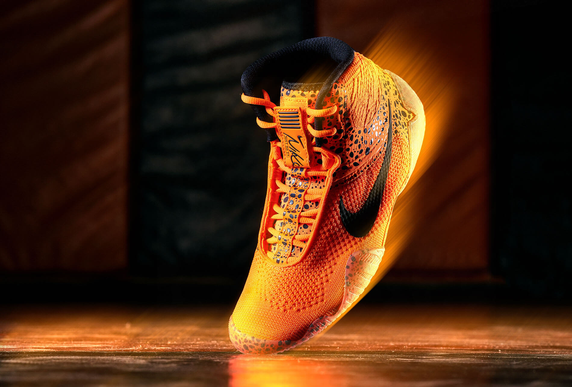 orange and black nike wrestling shoe