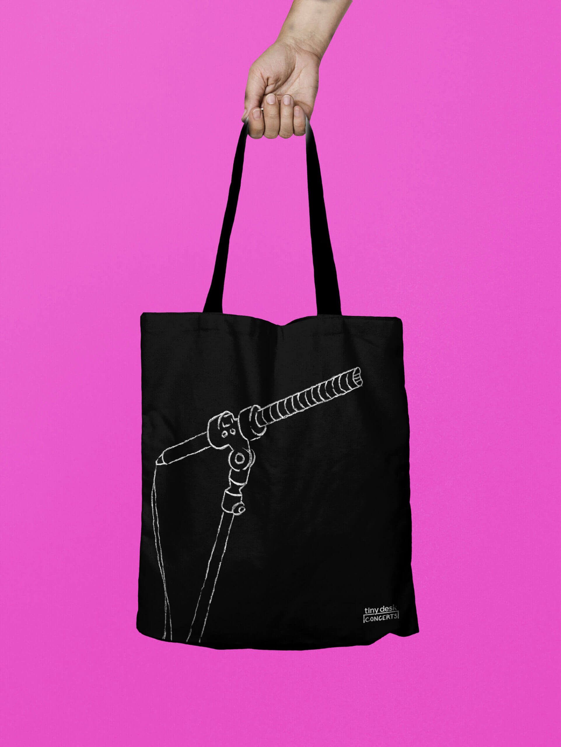 A tote bag with an illustration of a microphone.