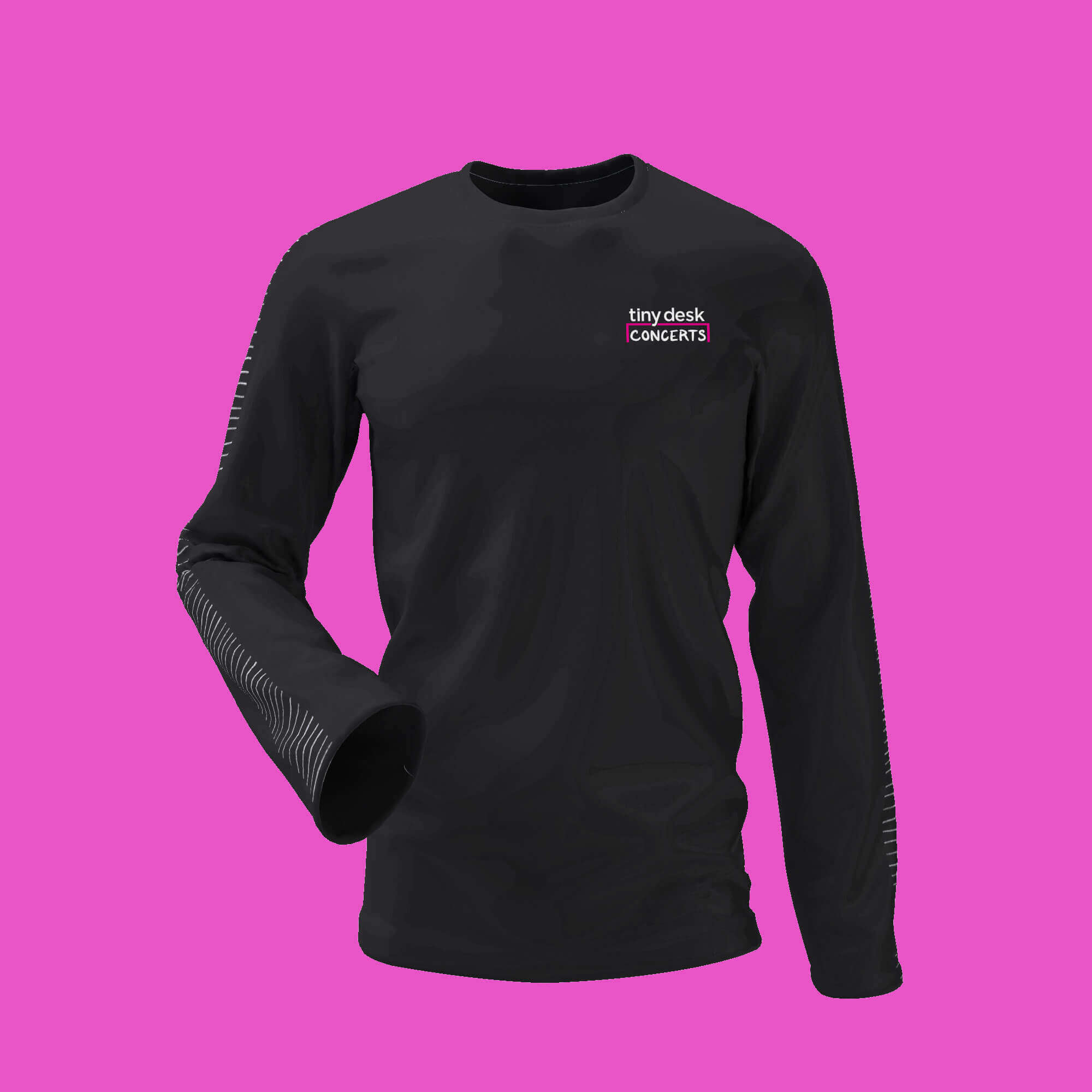 A black long-sleeve t-shirt on a pink background.