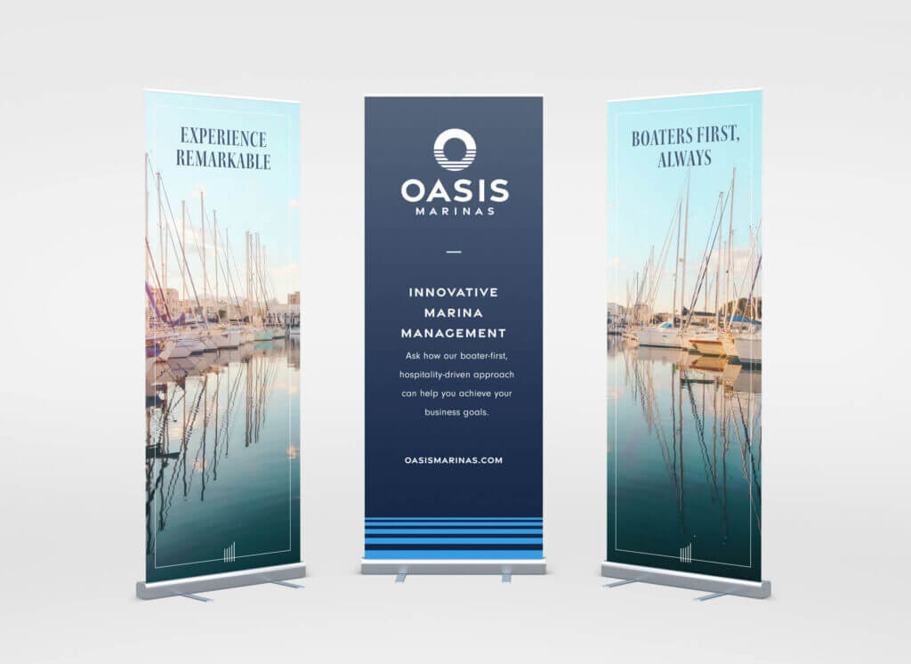Three trade show banners featuring information about Oasis Marinas.
