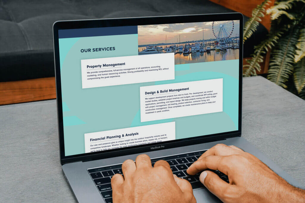 A laptop computer showing a page from the Oasis Experiences website.