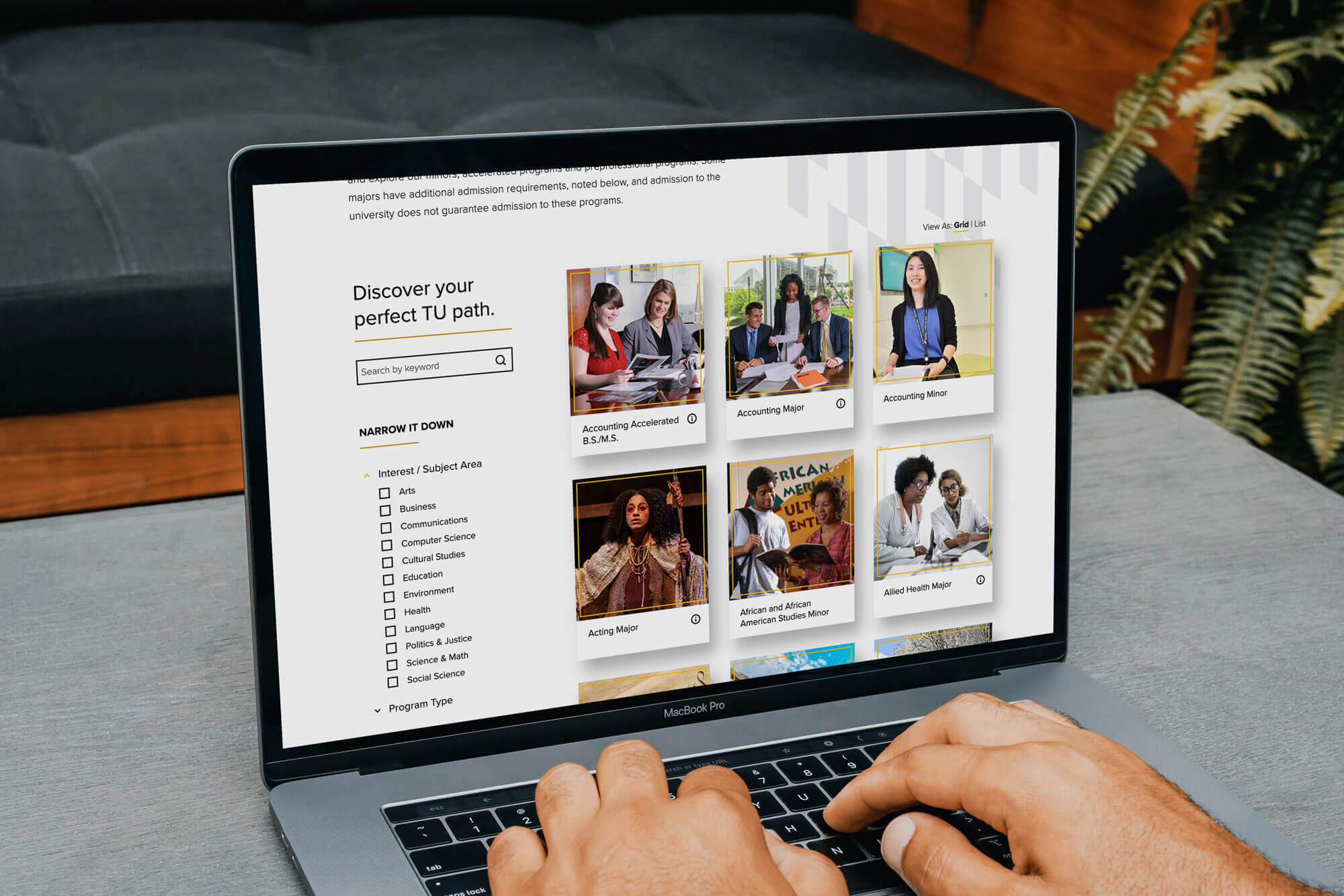 A laptop screen displaying a page from the Towson University website.