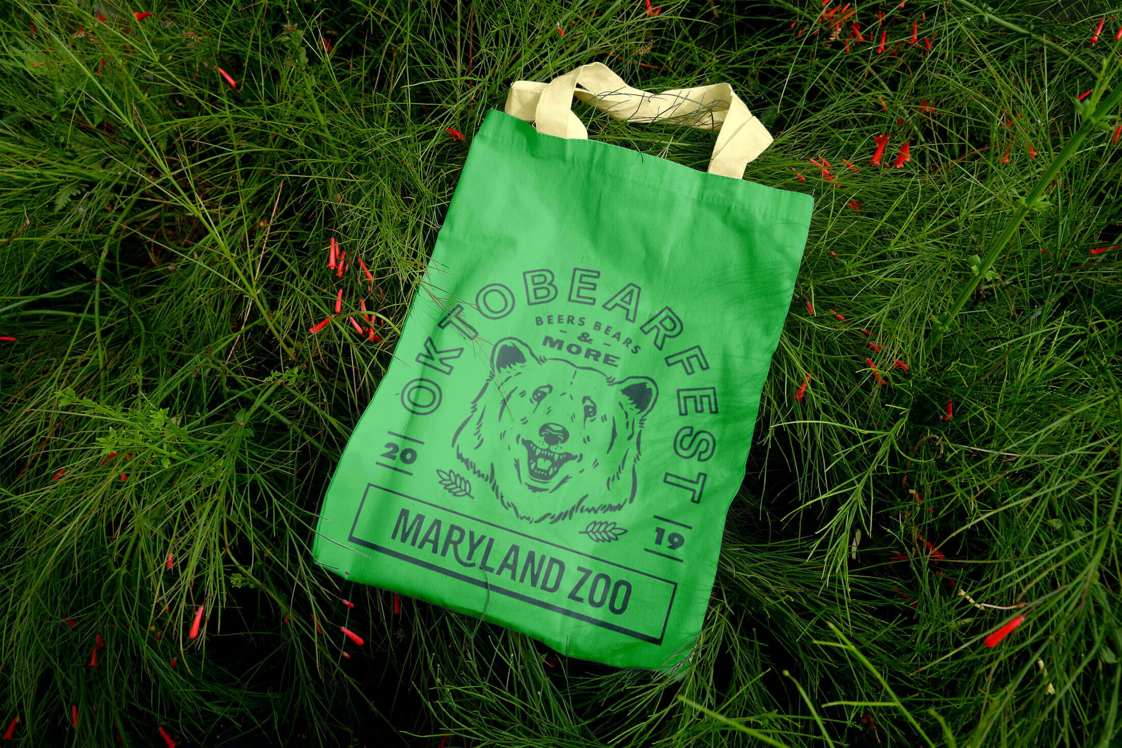 green totebag with monochromatic beer logo silkscreened on the front